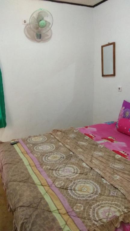 Postel nebo postele na pokoji v ubytování ADELYA HOMESTAY