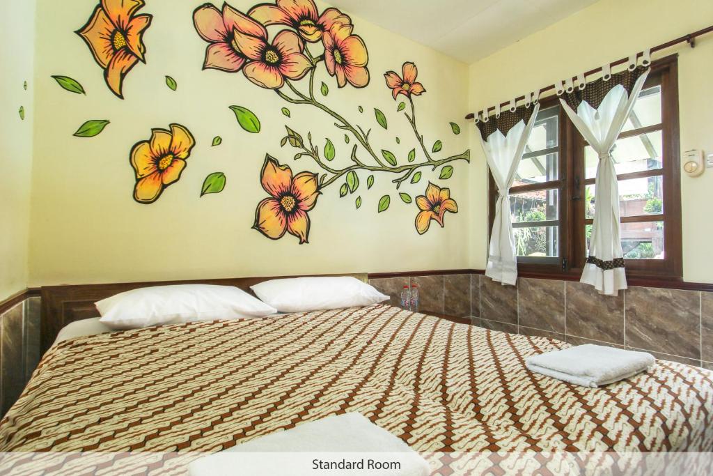 Postel nebo postele na pokoji v ubytování Delta Homestay