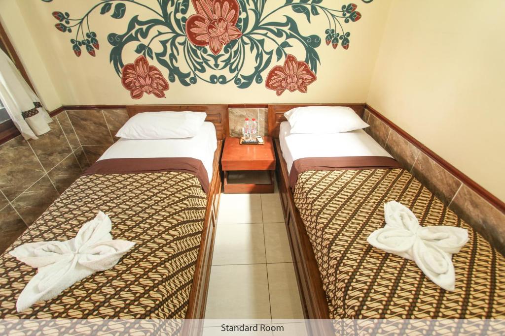 Postel nebo postele na pokoji v ubytování Delta Homestay