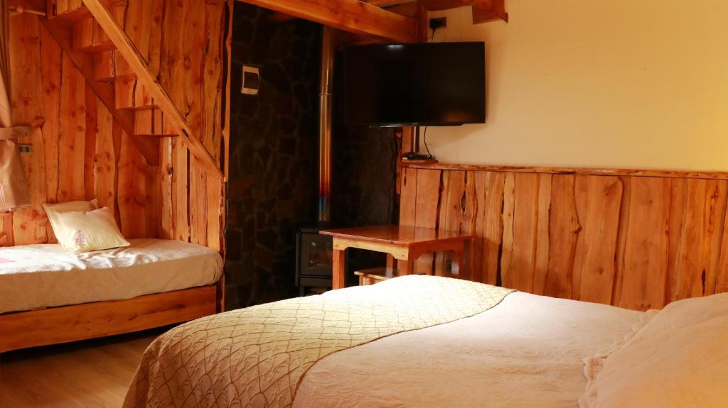 Postel nebo postele na pokoji v ubytování Cabañas Aitue