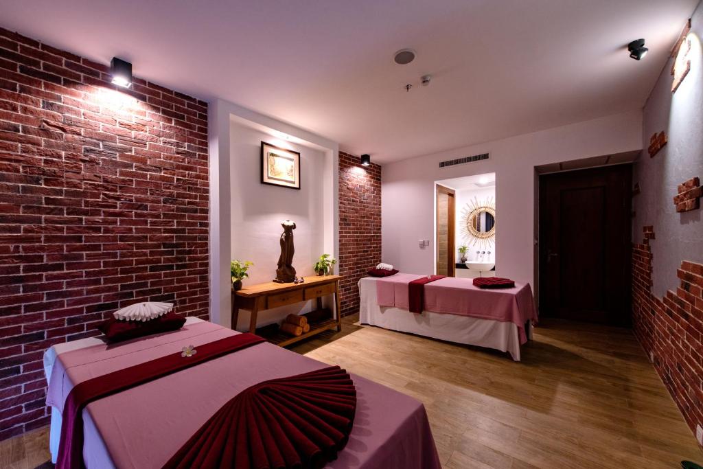 Postel nebo postele na pokoji v ubytování Pacific Hotel & Spa