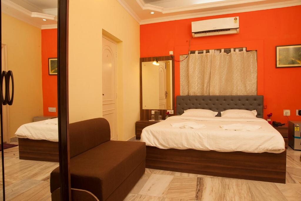 Postel nebo postele na pokoji v ubytování Om Sai Villa Guesthouse