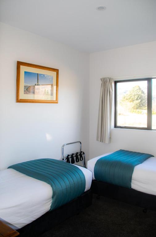 Postel nebo postele na pokoji v ubytování Carrick Lodge Motel