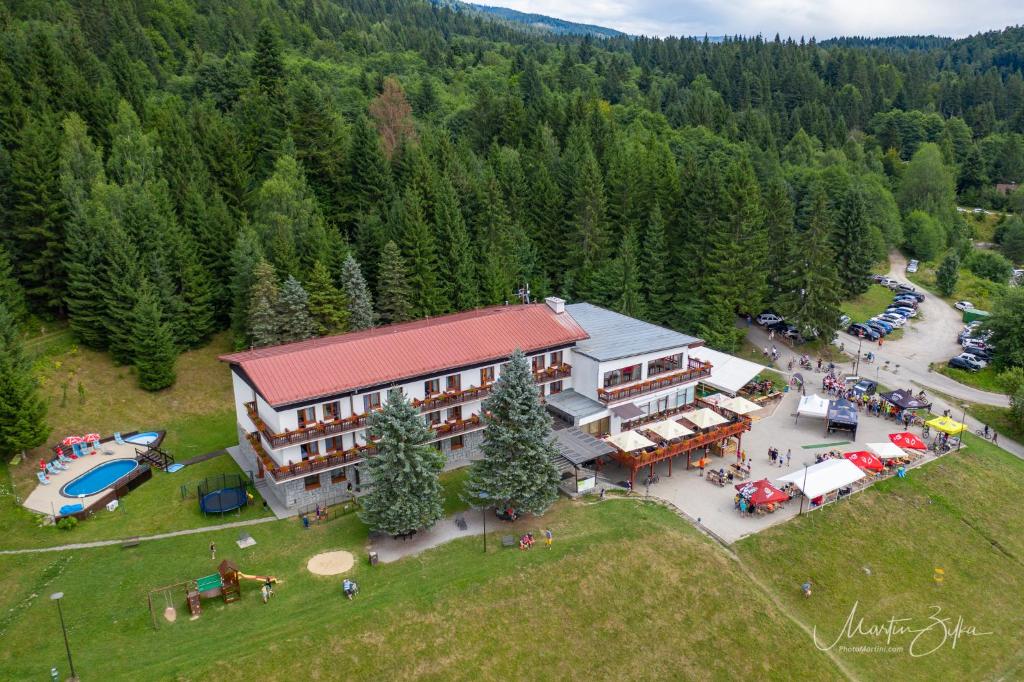an aerial view of a large building with a pool at Hotel Polianka in Krpacovo