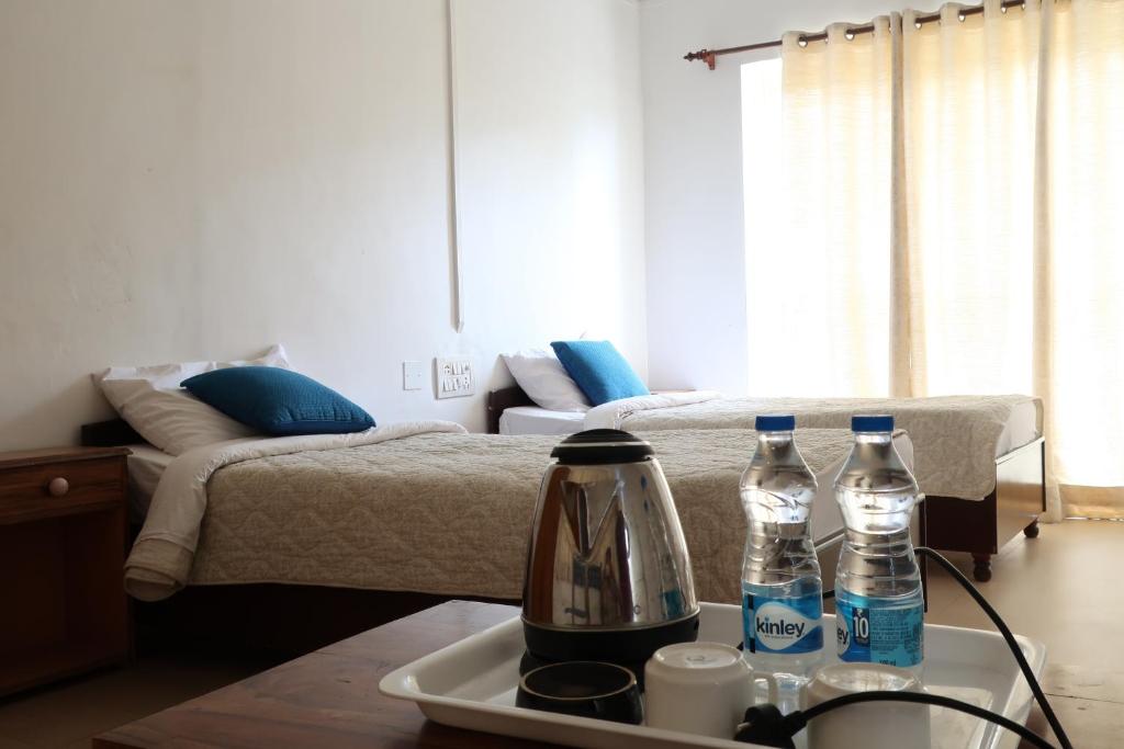 Postel nebo postele na pokoji v ubytování Zhim Zhim Guest House