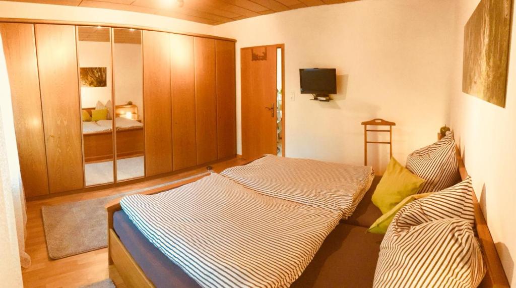 Postel nebo postele na pokoji v ubytování Ferienwohnung zum Nationalpark