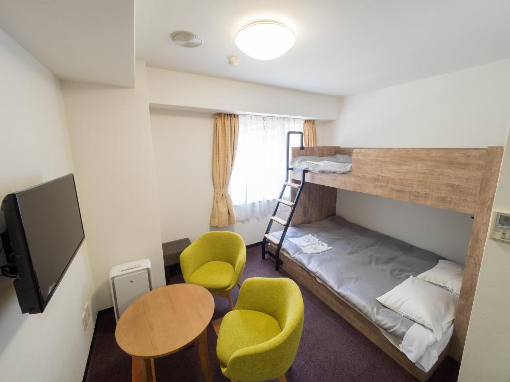 Postel nebo postele na pokoji v ubytování Hotel Shin Osaka