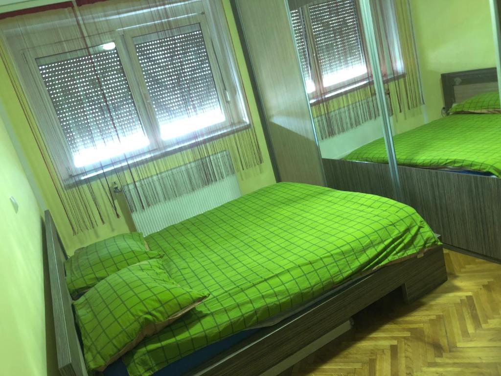 Postel nebo postele na pokoji v ubytování Tanja apartman