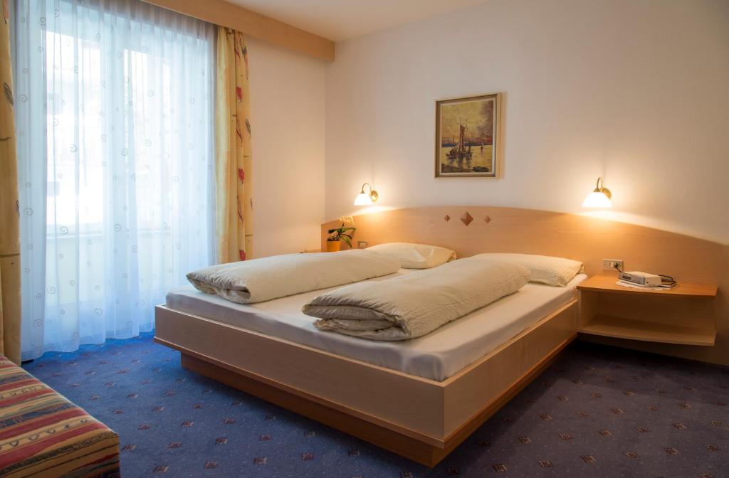 Postel nebo postele na pokoji v ubytování Residence Königsrainer