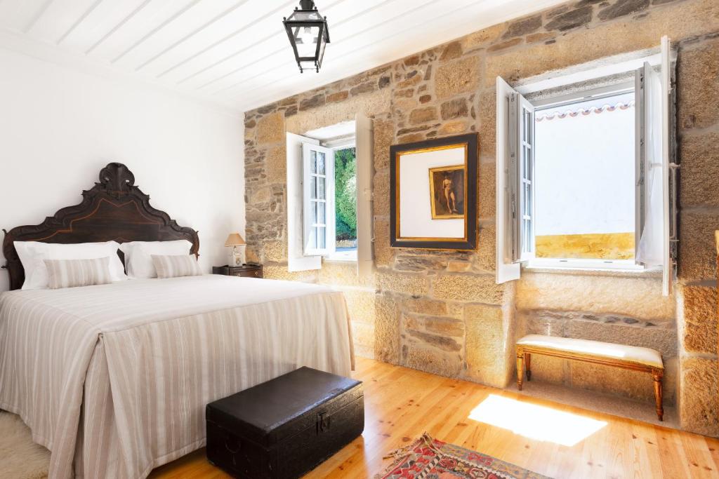 Postel nebo postele na pokoji v ubytování Quinta do Valdalágea