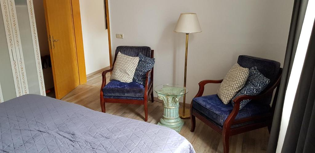 Postel nebo postele na pokoji v ubytování Art Apartment - Harz