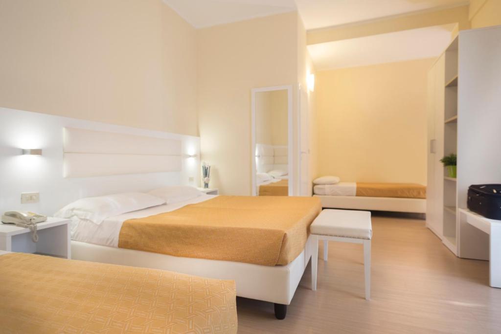 Postel nebo postele na pokoji v ubytování Hotel San Domingo