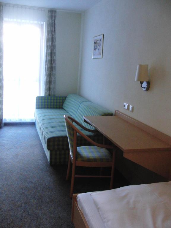 Postel nebo postele na pokoji v ubytování Hotel Angerer