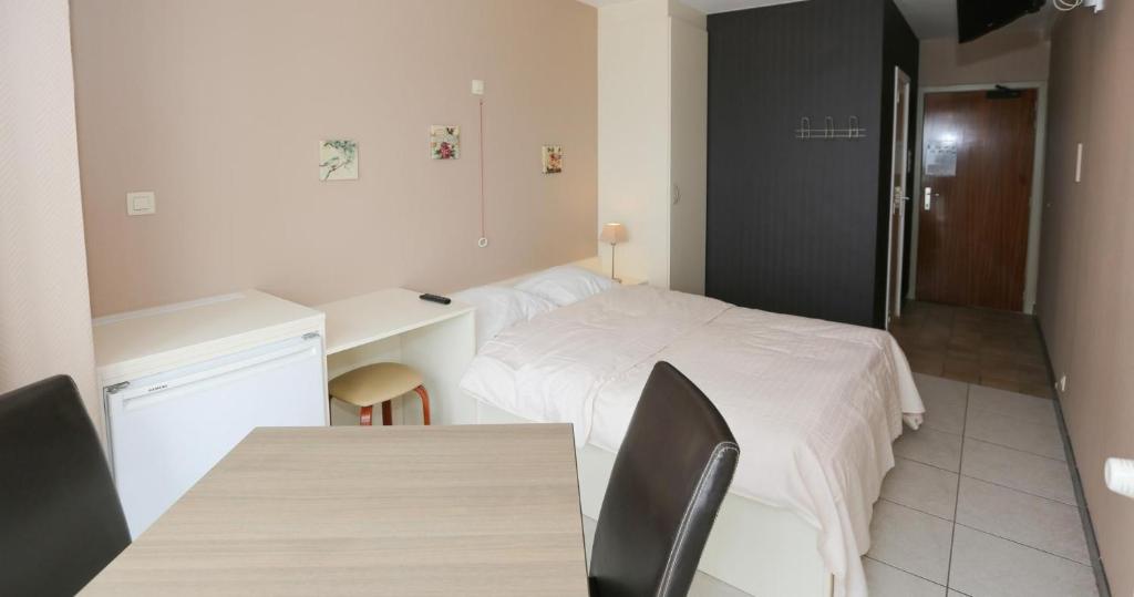 Postel nebo postele na pokoji v ubytování Hotel De Zeebries Budget