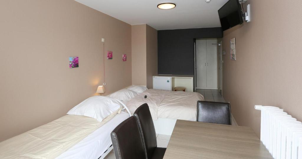 Postel nebo postele na pokoji v ubytování Hotel De Zeebries Budget