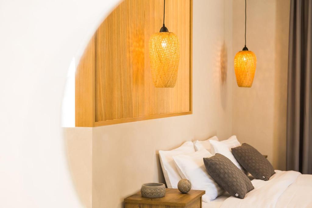 Postel nebo postele na pokoji v ubytování Calmare suites