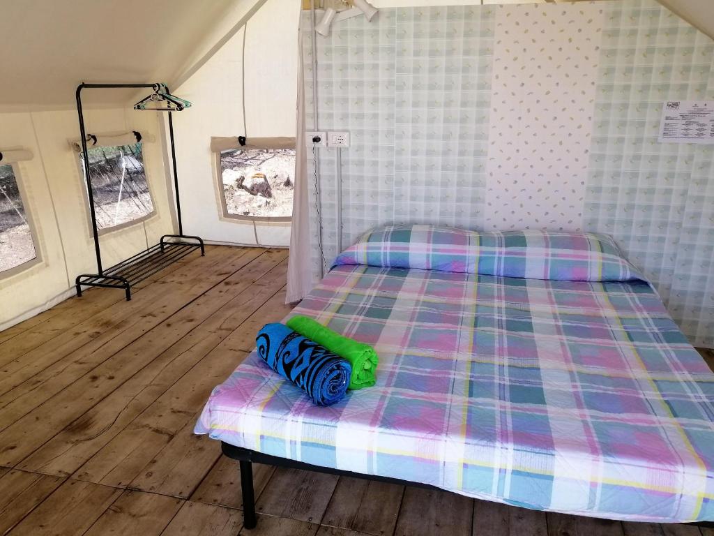 Postel nebo postele na pokoji v ubytování Agriturismo Glamping Erbe Matte