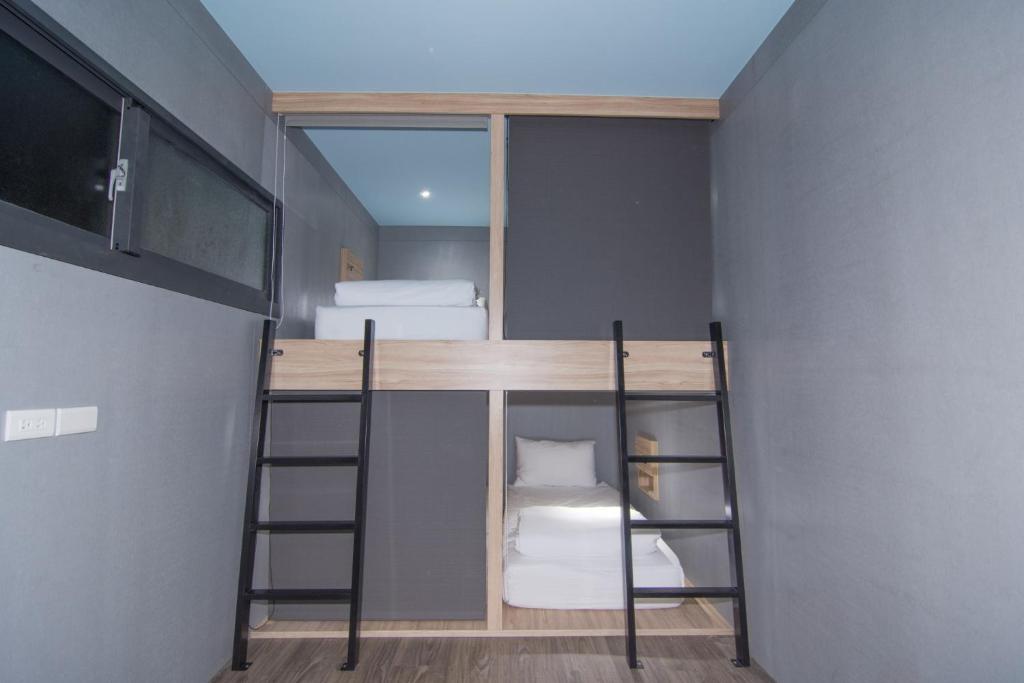 Postel nebo postele na pokoji v ubytování Liuqiu Dive Hostel