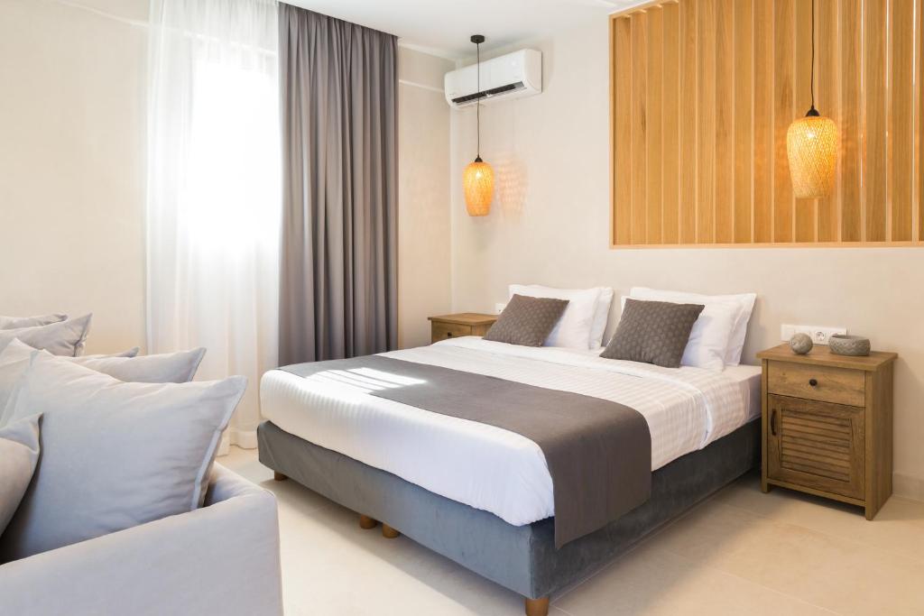 Postel nebo postele na pokoji v ubytování Calmare suites