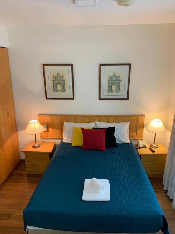a bedroom with a bed with a tray on it at Charmoso Flat em Pinheiros in Sao Paulo
