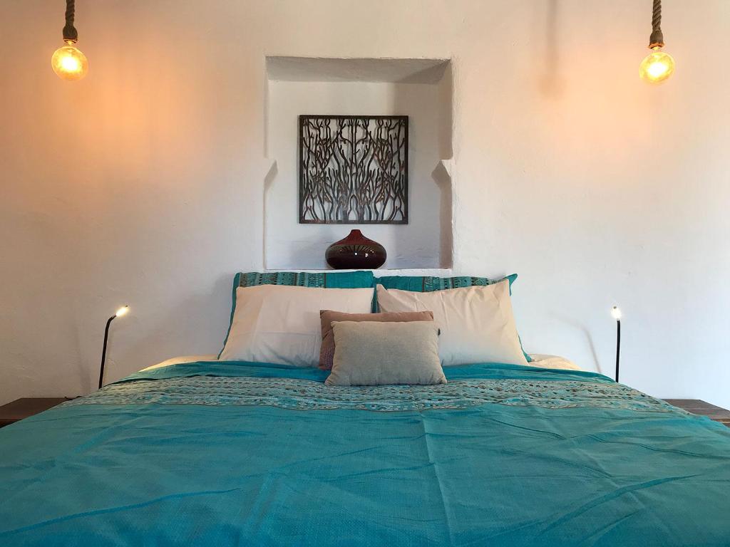 Postel nebo postele na pokoji v ubytování Finca Zayas Casa Rural & Guest Suites