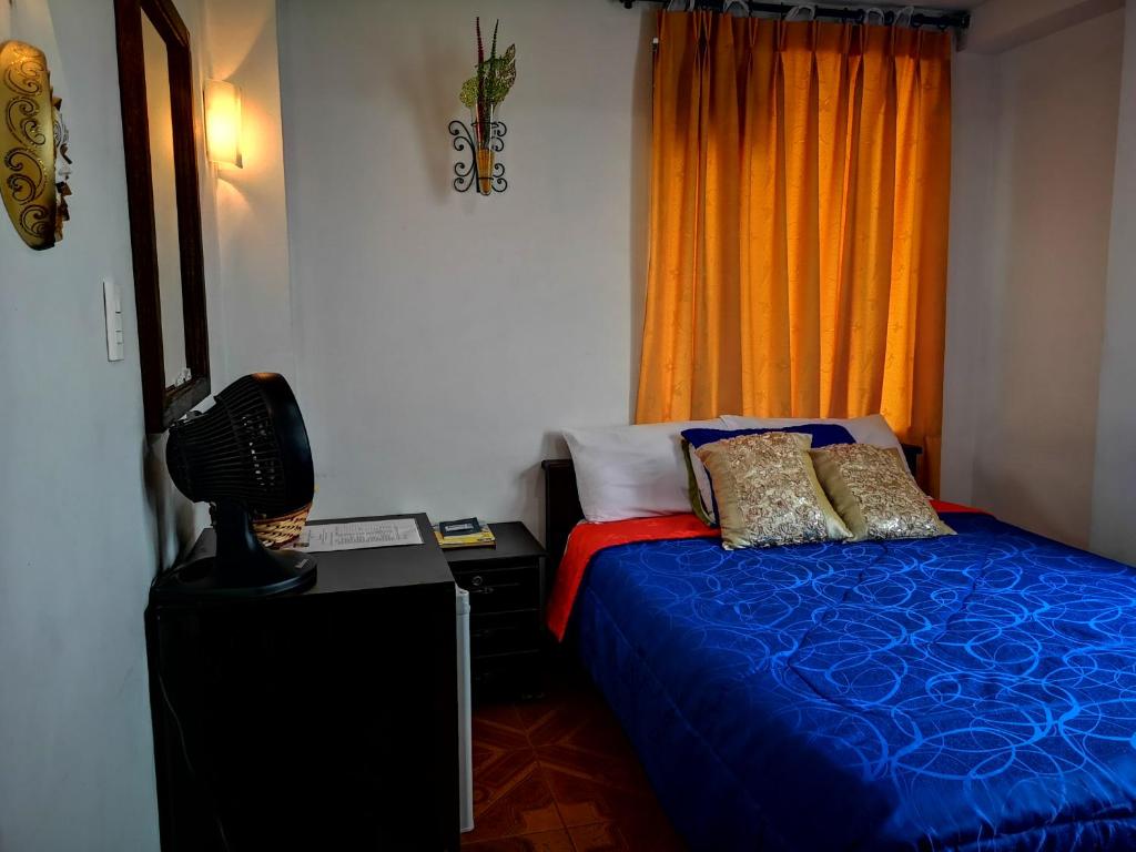 Postel nebo postele na pokoji v ubytování Hotel Royal Suite