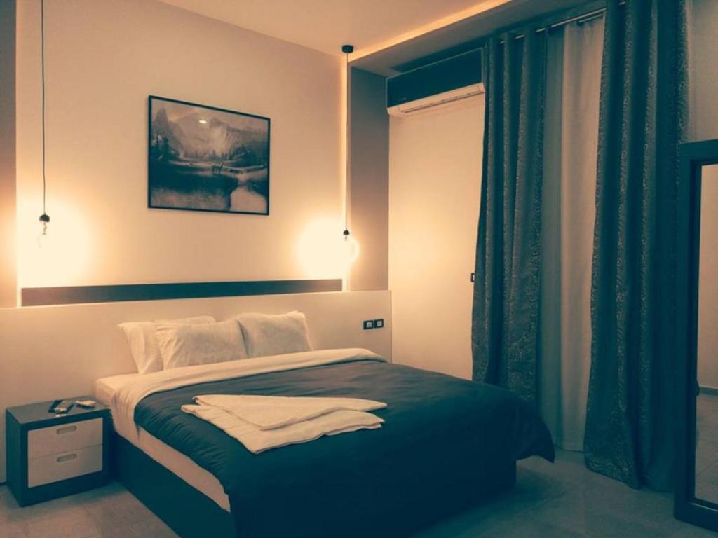 Postel nebo postele na pokoji v ubytování Azar Boutique Hotel