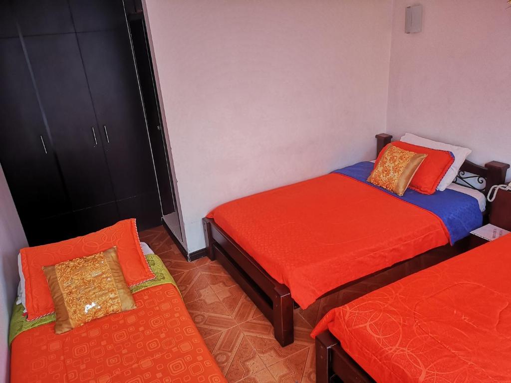 Postel nebo postele na pokoji v ubytování Hotel Royal Suite