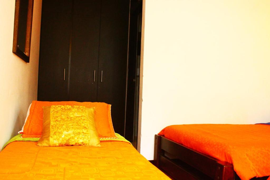 Postel nebo postele na pokoji v ubytování Hotel Royal Suite
