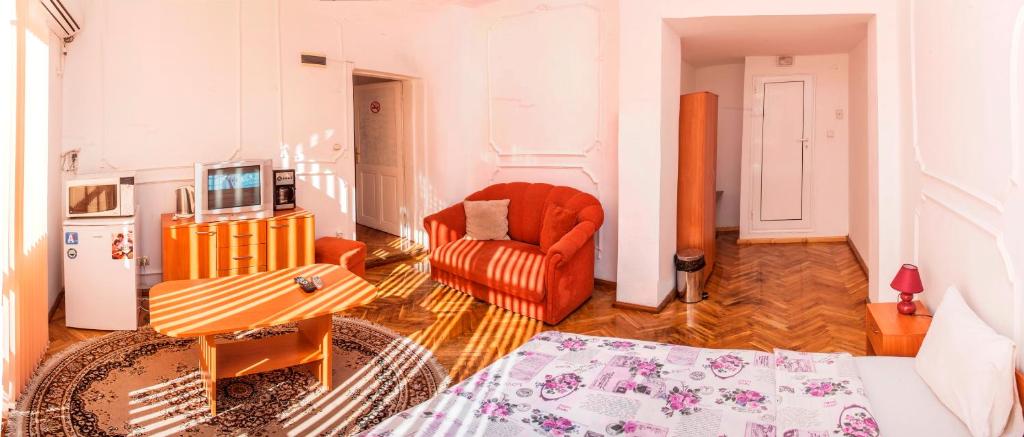 A bed or beds in a room at Central GuestHouse Five Corners