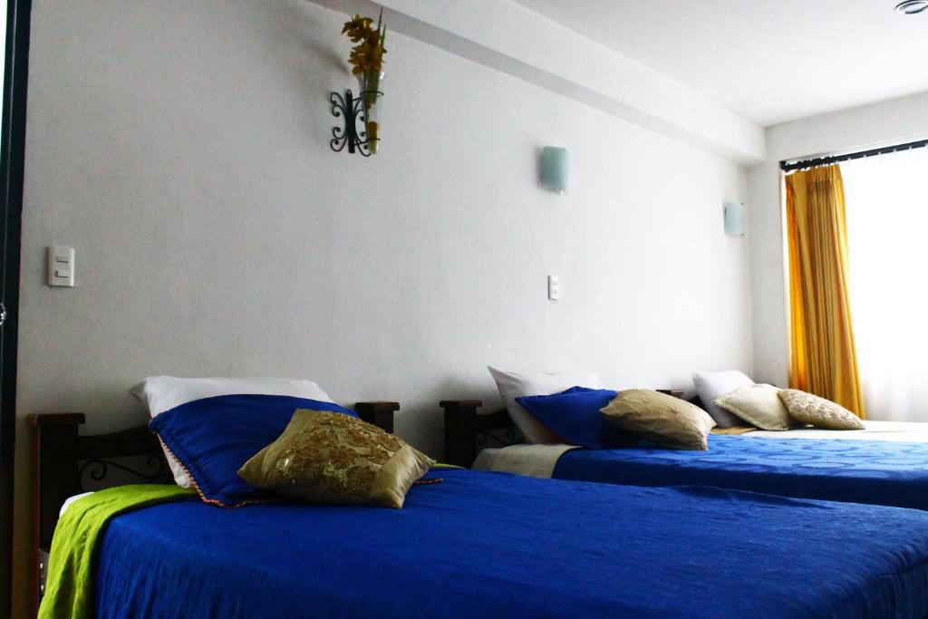 Postel nebo postele na pokoji v ubytování Hotel Royal Suite