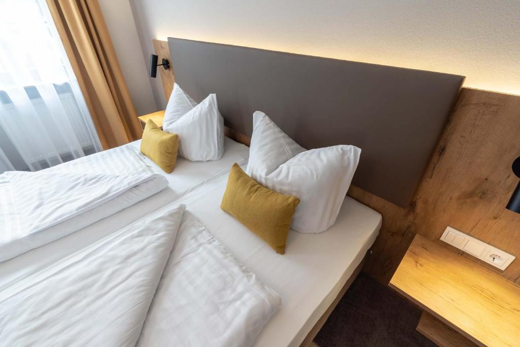 Postel nebo postele na pokoji v ubytování Hotel & Restaurant Ritter Jörg