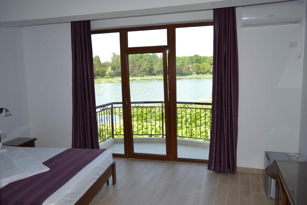 Postel nebo postele na pokoji v ubytování Hotel Insula