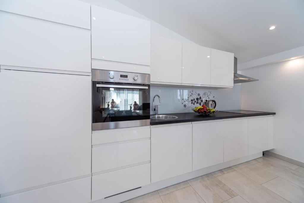 Kuchyň nebo kuchyňský kout v ubytování Apartment Antonio