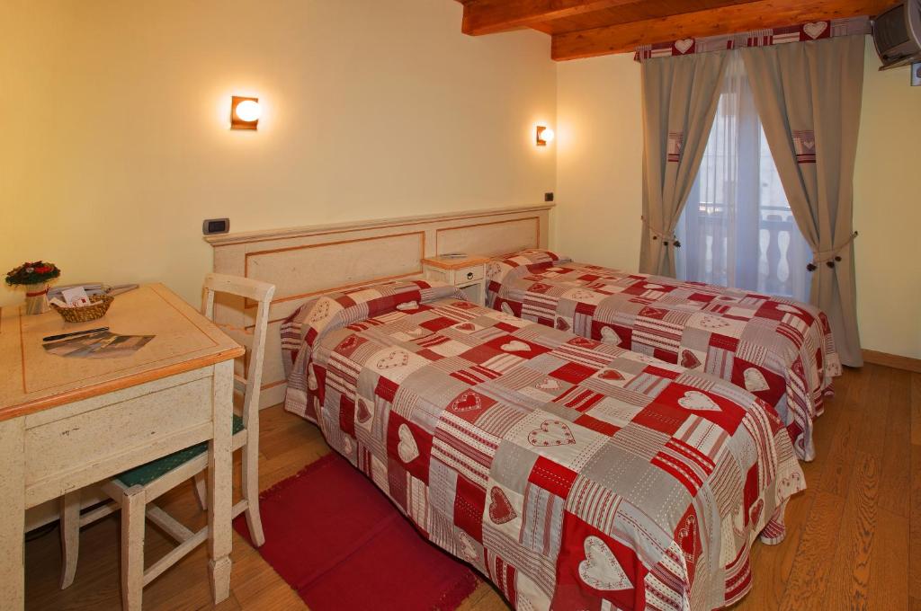 Postel nebo postele na pokoji v ubytování Hotel Chez Toi