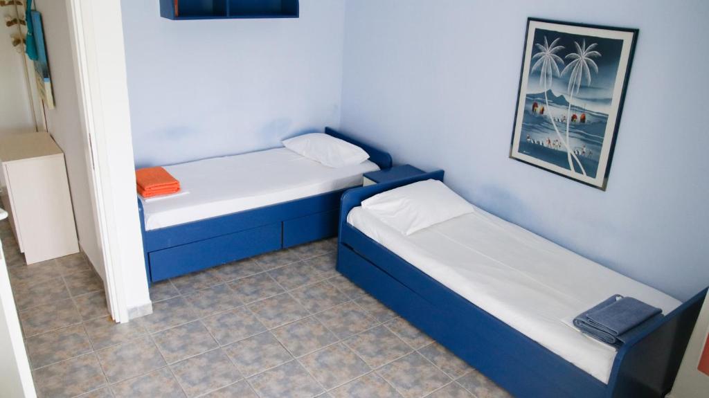 Posteľ alebo postele v izbe v ubytovaní Nanas Apartment