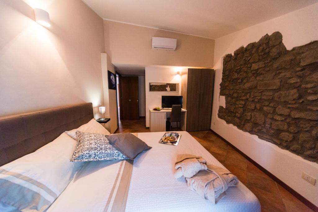 Posteľ alebo postele v izbe v ubytovaní Le Undici Rose Hotel