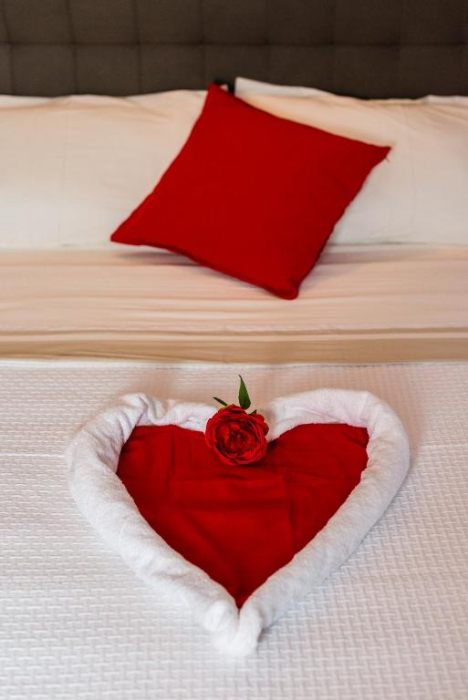 Posteľ alebo postele v izbe v ubytovaní Le Undici Rose Hotel