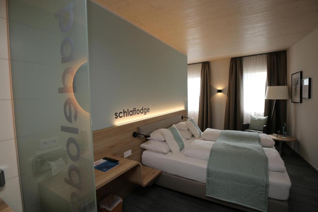 Postel nebo postele na pokoji v ubytování Donau Lodge