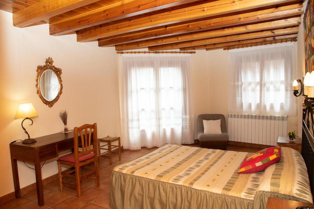 Cama o camas de una habitación en Turisme Rural Lo Pallé de Cal Bosch