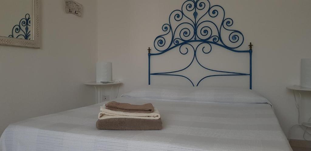 Postel nebo postele na pokoji v ubytování Le pavoncelle blu