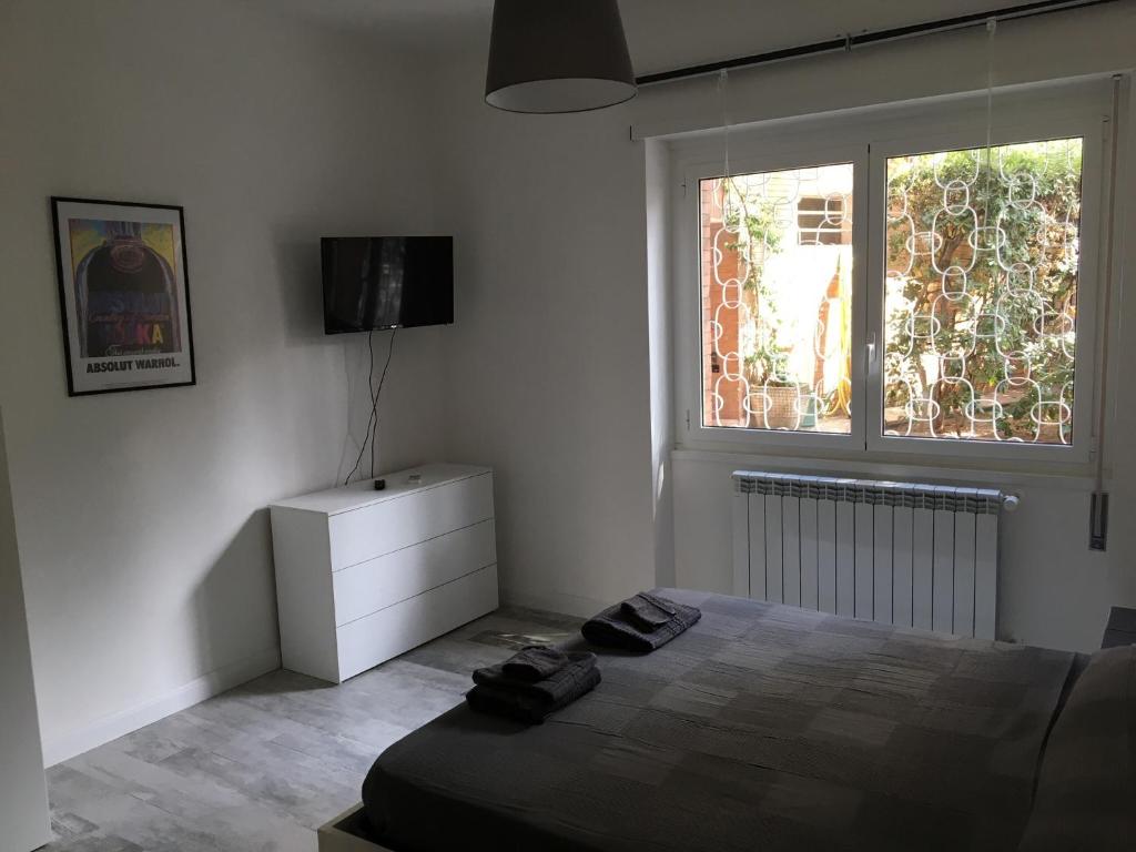 A bed or beds in a room at OASI METROPOLITANA Apartment
