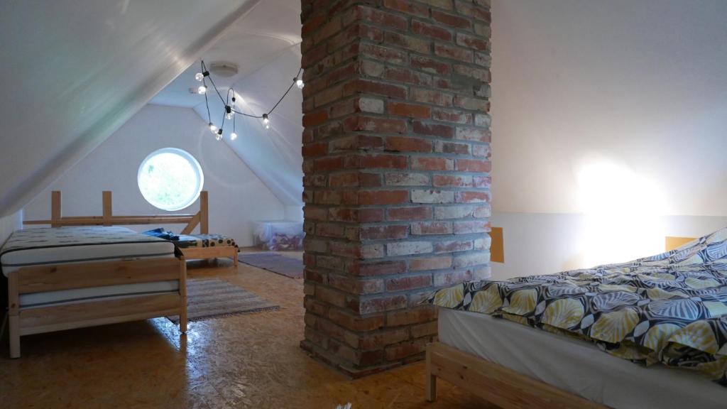 Postel nebo postele na pokoji v ubytování Allika-Löövi Sauna Cabin