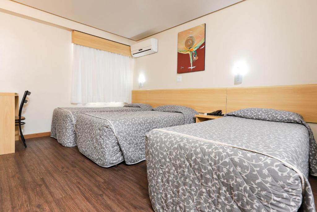 Postel nebo postele na pokoji v ubytování Hotel Express Terminal Tur - Rodoviária Porto Alegre
