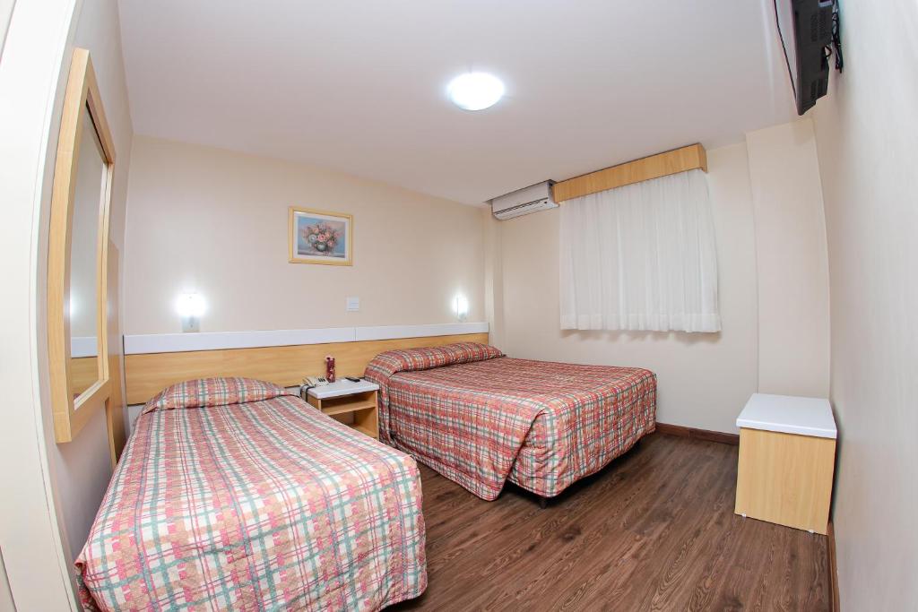 Postel nebo postele na pokoji v ubytování Hotel Express Terminal Tur - Rodoviária Porto Alegre