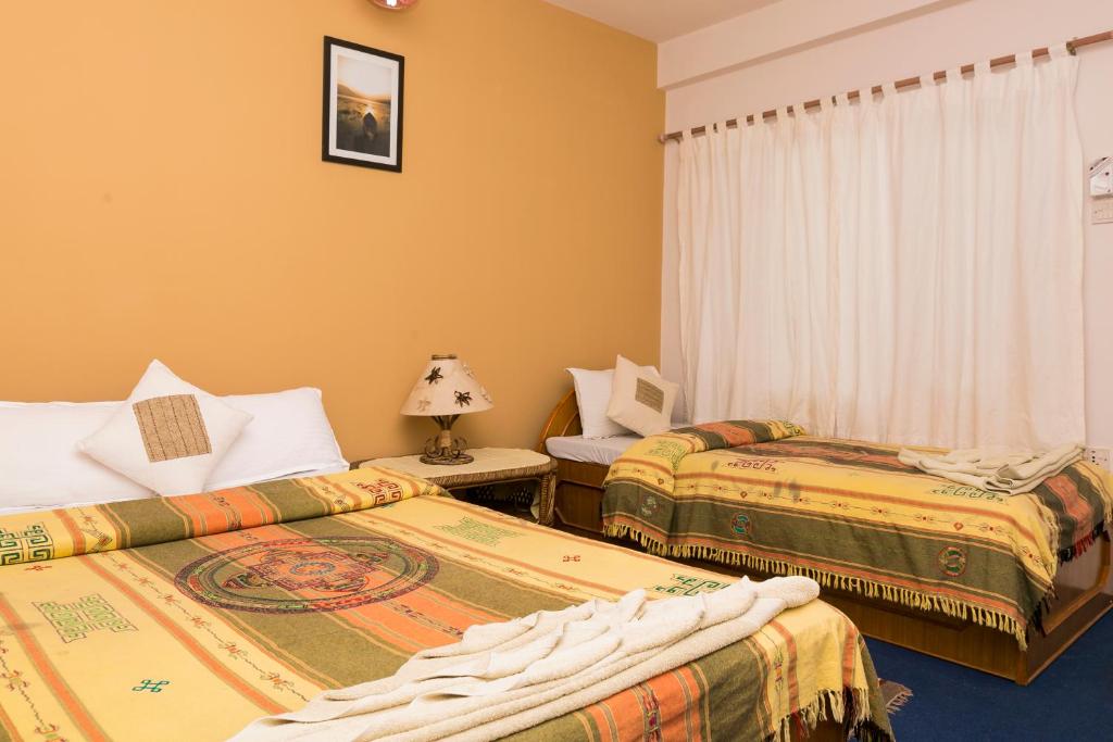 Letto o letti in una camera di Peace Eye Guest House