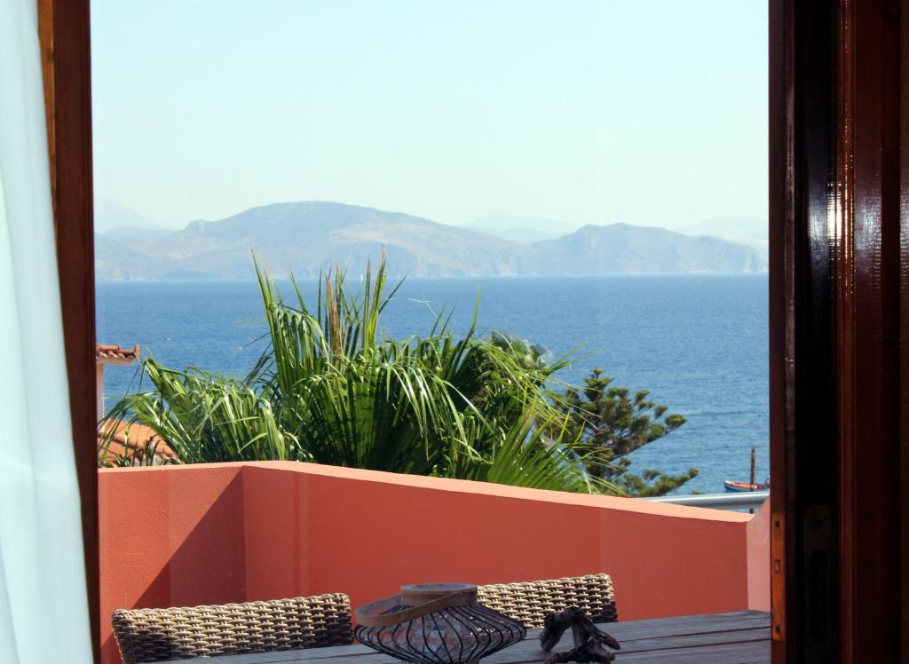 a view of the ocean from a balcony at Apartments Balaska in Xiropigado