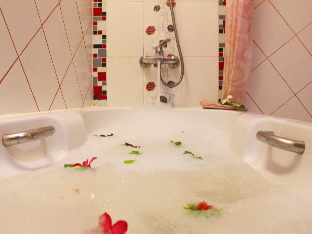 a bath tub filled with water with debris at Baan Boa Resort in Patong Beach