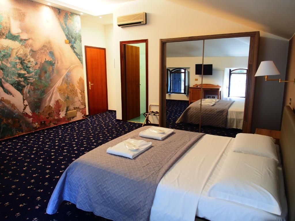 Posteľ alebo postele v izbe v ubytovaní Hotel Parco Fola