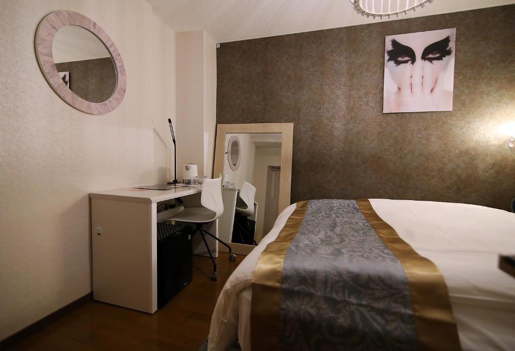 Postel nebo postele na pokoji v ubytování SHINJUKU GLOBAL HOTEL